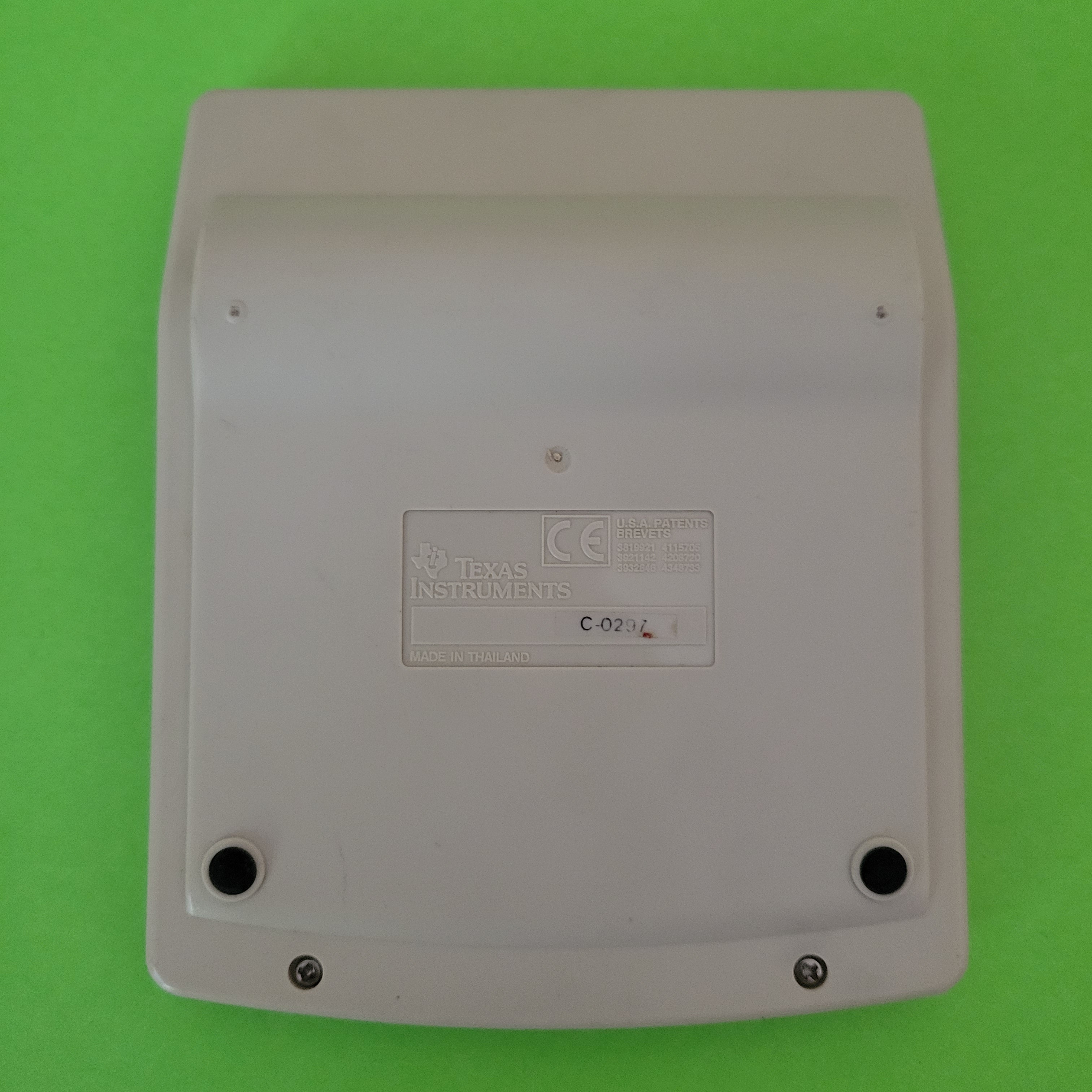 An image of the back of a ti-1795 plus four function plus calculator
